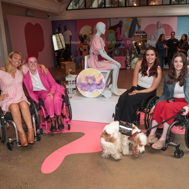 Sophie Morgan with a group of wheelchair users in front of the first wheelchair mannequin