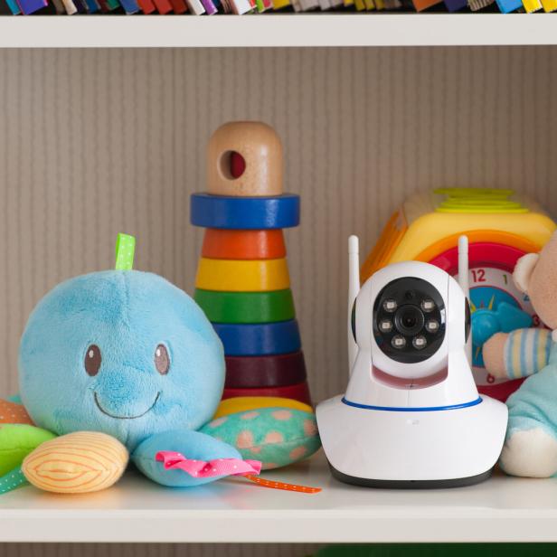 IP camera on the shelf with toys, serving as a baby monitor IP camera on the shelf with toys, serving as a baby monitor