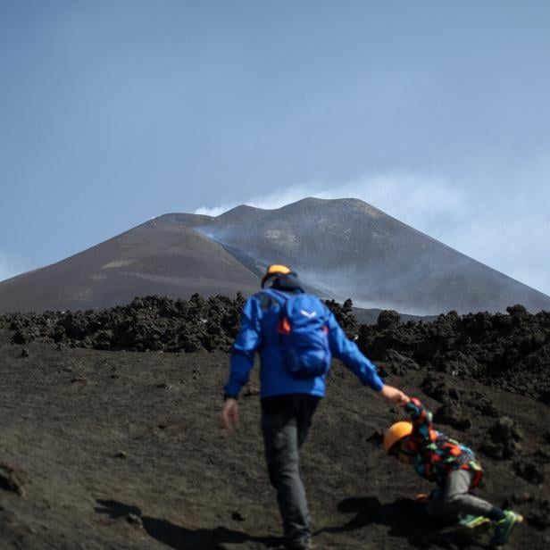 Tourism on Mount Etna during eruption Tourism on Mount Etna during eruption