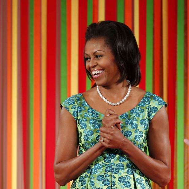 First lady Michelle Obama smiles at the first ever kids "State Dinner" at the White House in Washington