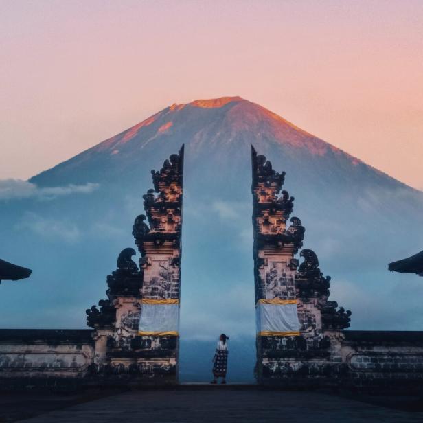 Traveler Standing at the Gates of Pura Lempuyang Temple aka Gates of Heaven Bali, Indonesia