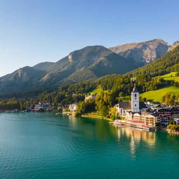 Beautiful aerial view of the popular village of Sankt Wolfgang im Salzkammergut. Alpine mountains, church and Wolfgangsee. Upper Austria, Salzburg.