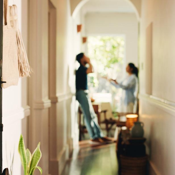 Frustrated couple, fight or hallway with argument, conflict or disagreement for breakup in home. Angry, man and woman shouting with dispute for toxic relationship, cheating affair or divorce in house