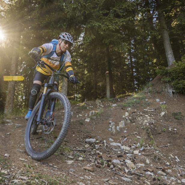Mountainbike downhill in the forest, Austria.