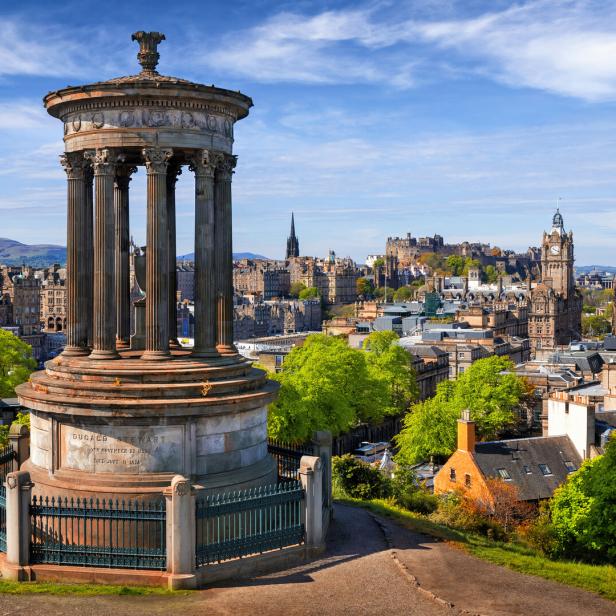 Dugald Stewart Monument and view over historic Edinburgh from Calton Hill, Scotland, UK