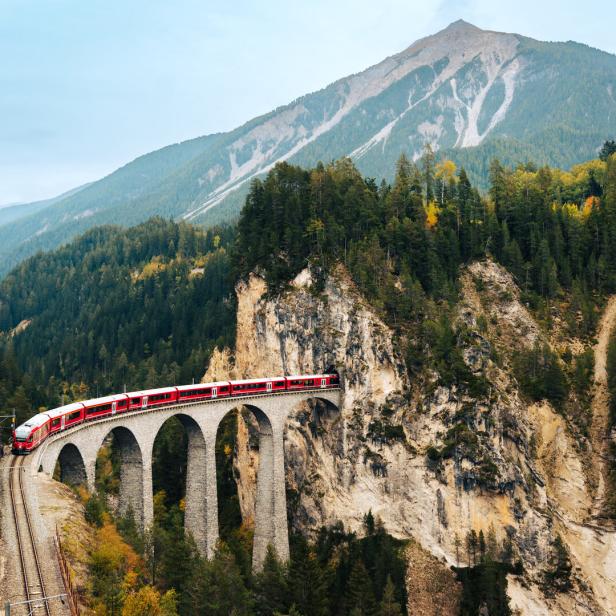 Scenic Train Journey Through Mountains in Switzerland