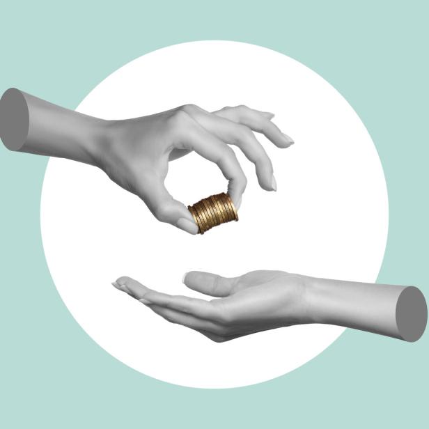 A woman's hand holds coins and hands them to a man