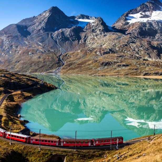 swiss train in the alps mountains in switzerland around ospizio bernina